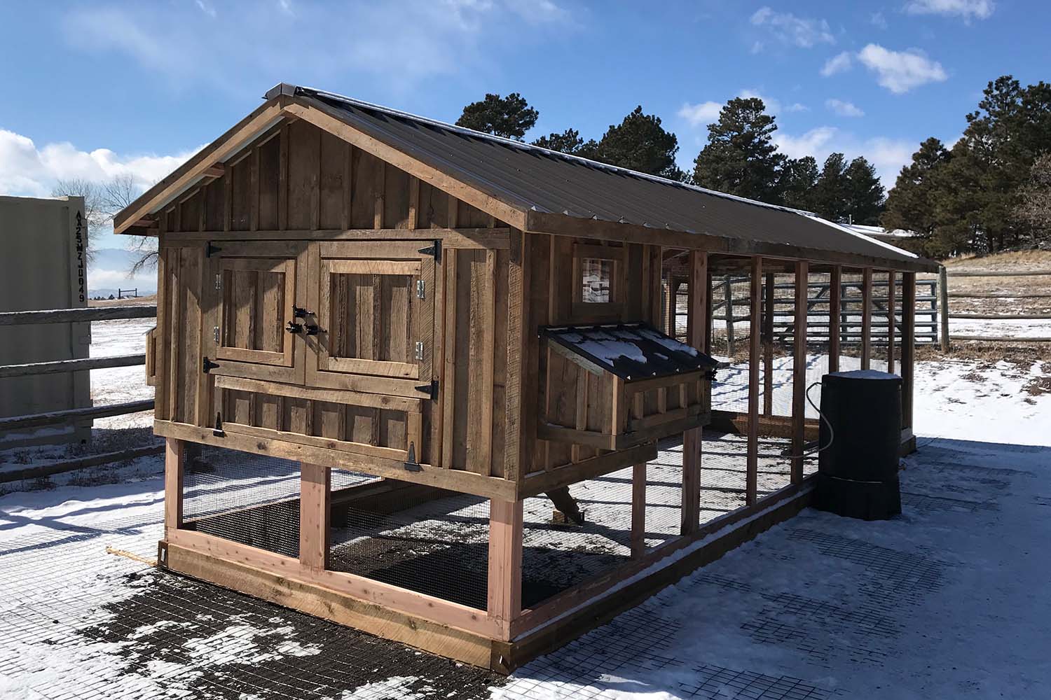 8′ x 24′ Carolina Coop with red cedar framing and board and batten reclaimed barnwood siding in Colorado Springs, CO