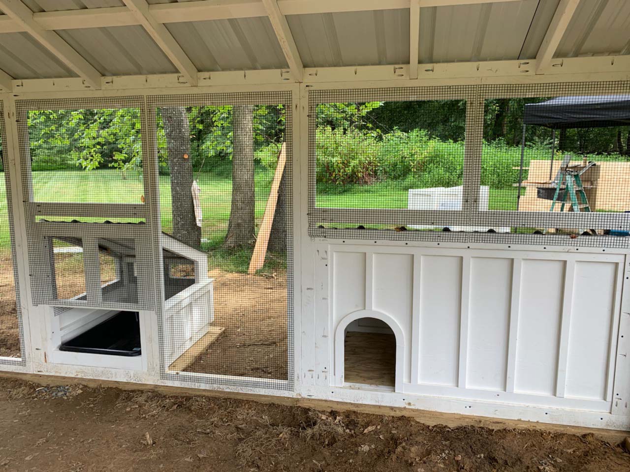 Interior shot of custom duck and chicken coop with duck dipper