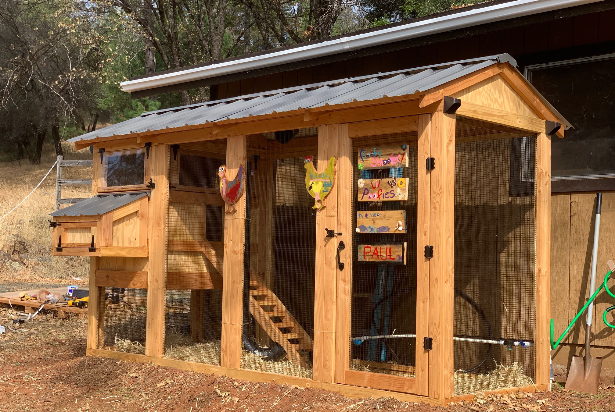 California Coop with run extension and dark grey roof and black hardware in California