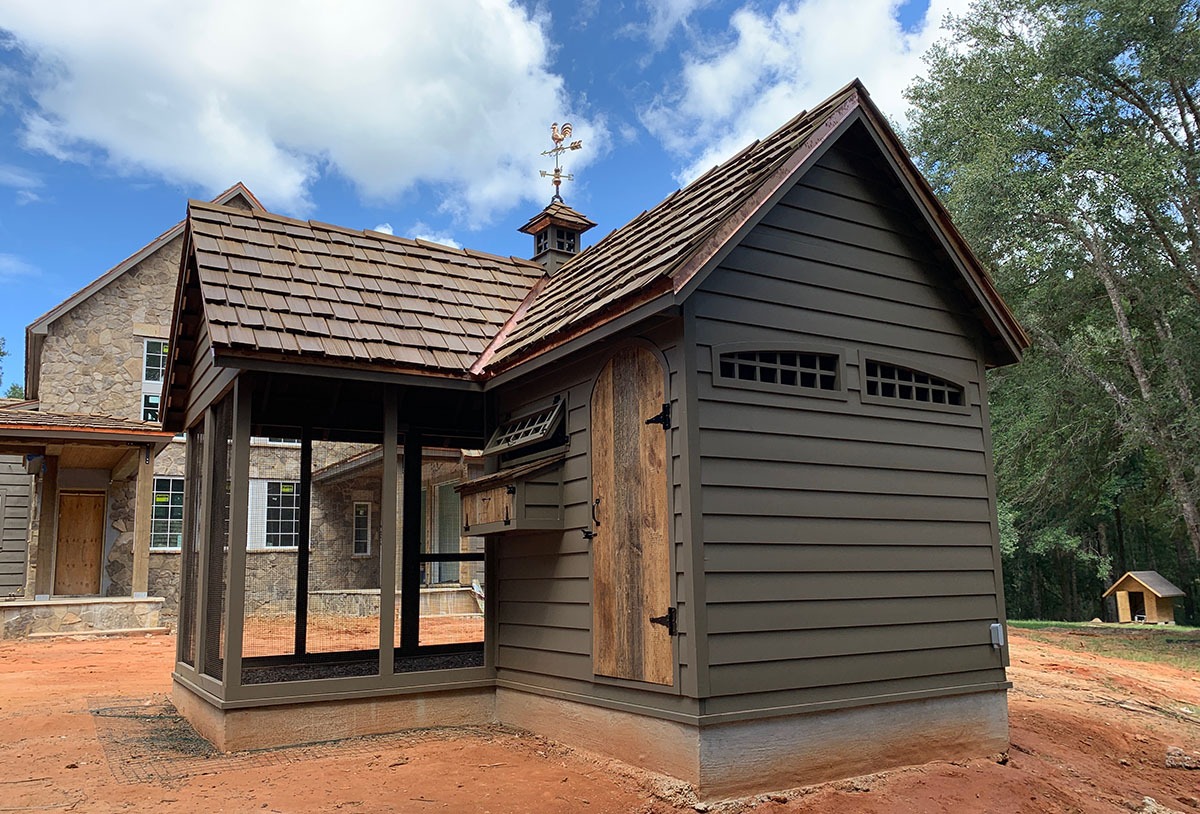 Carolina Coops custom Alabama Chicken Coop built to match the main house with cupola and reclaimed barn wood