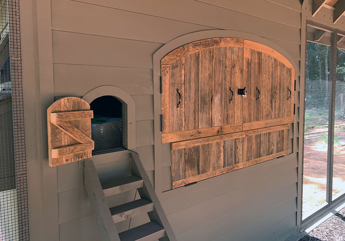 Custom Alabama Coop interior with removable reclaimed barn wood henhouse doors