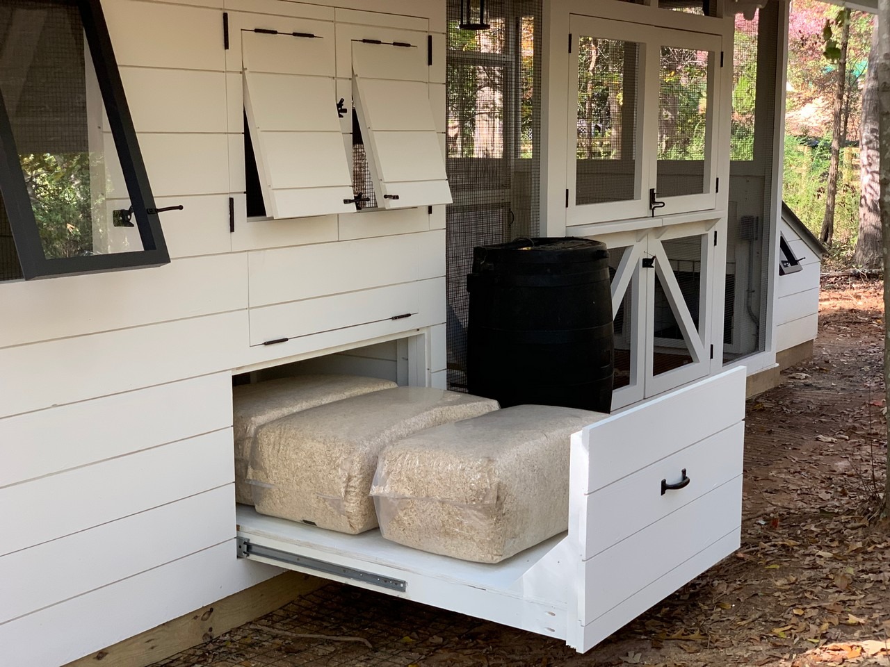 under the henouse storage with roll out drawers on the modern farmhouse custom chicken and duck coop