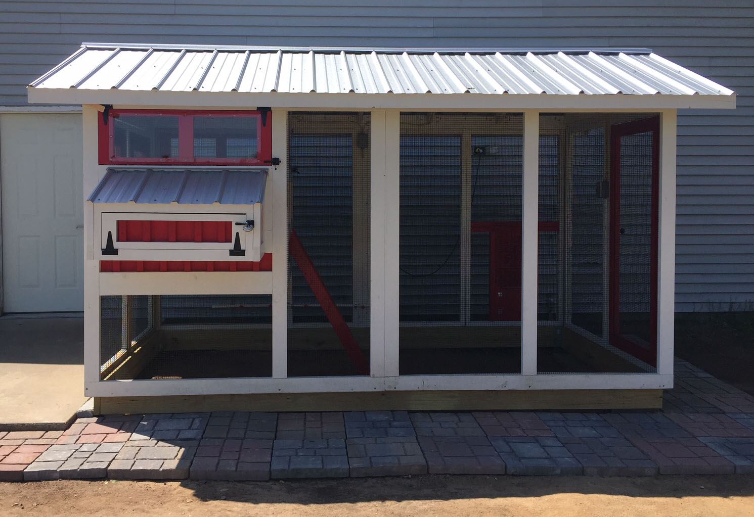 6’x12′ American Coop painted red and white with black hardware and Galvalume roof