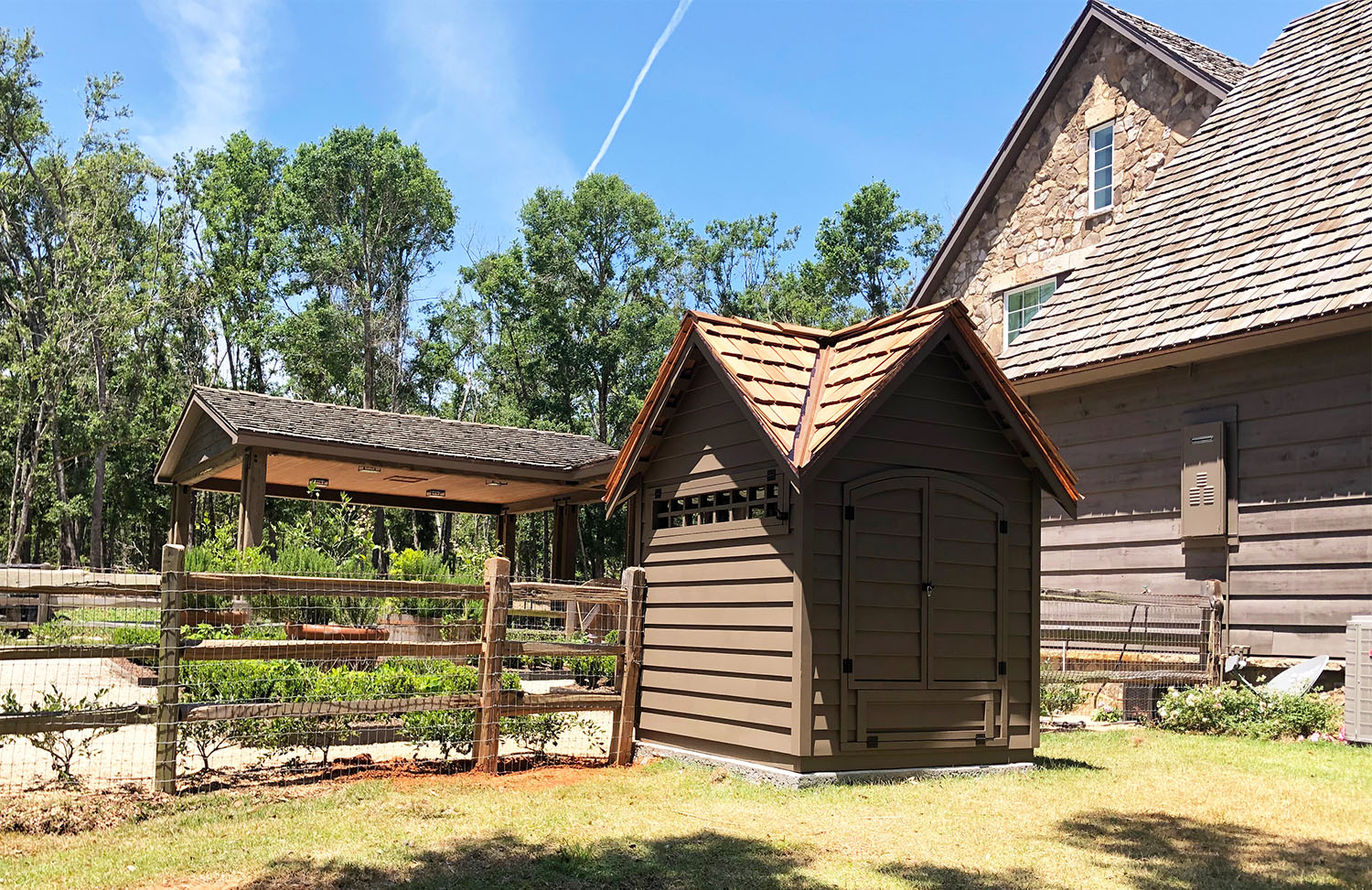 Back of custom Goose House in Alabama with clapboard siding and hand split cedar shingle roof