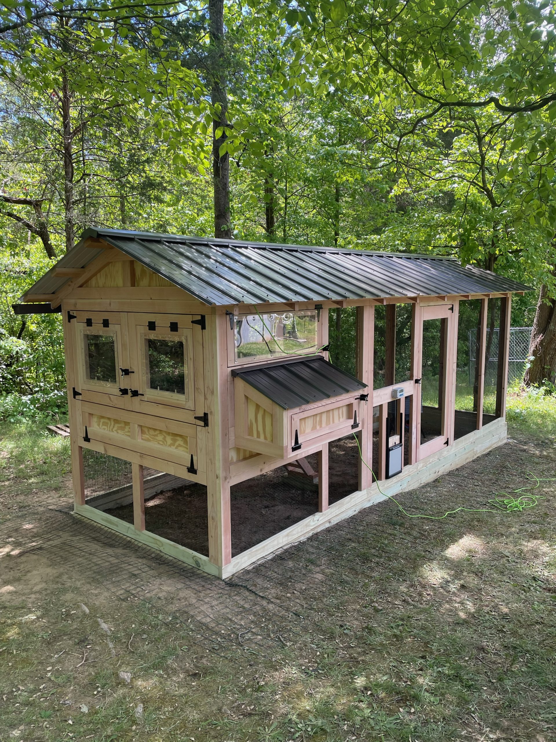 Back of 6×18 American Coop with automatic free range door and poultry water system built on a base in Mascot, TN